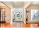 Bright entryway with hardwood floors and stained glass door at 5681 Berry Ridge Dr, Harrisburg, NC 28075