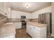 Kitchen with stainless steel appliances and tile countertops at 5681 Berry Ridge Dr, Harrisburg, NC 28075