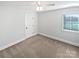 Bright bedroom with carpeted floor, neutral walls, and a window with blinds at 6000 Bickett Ridge Dr, Monroe, NC 28110