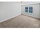 Spacious bedroom with neutral wall colors and plush carpet at 6000 Bickett Ridge Dr, Monroe, NC 28110