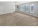 Main bedroom with carpet, lots of windows, and door to deck at 6000 Bickett Ridge Dr, Monroe, NC 28110