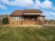 Brick house with covered porch and expansive backyard at 6000 Bickett Ridge Dr, Monroe, NC 28110