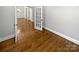 Hardwood floors in an open living area with French doors at 6000 Bickett Ridge Dr, Monroe, NC 28110