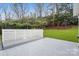 Gray deck and white fence overlooking a grassy backyard at 6030 Sharon Hills Rd, Charlotte, NC 28210