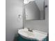 Small bathroom with vanity and a teal cabinet at 6030 Sharon Hills Rd, Charlotte, NC 28210