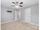 Spacious bedroom with neutral walls and ceiling fan at 6030 Sharon Hills Rd, Charlotte, NC 28210