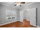 Spacious bedroom with hardwood floors and neutral walls at 6030 Sharon Hills Rd, Charlotte, NC 28210