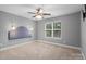 Bedroom with ceiling fan and window, neutral colors at 6030 Sharon Hills Rd, Charlotte, NC 28210