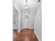 Bright entryway with hardwood floors and a modern light fixture at 6030 Sharon Hills Rd, Charlotte, NC 28210