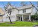 Two-story house with neutral siding, white trim, and a two-car garage at 6030 Sharon Hills Rd, Charlotte, NC 28210