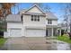 Two-story house with neutral siding, white trim, and a two-car garage at 6030 Sharon Hills Rd, Charlotte, NC 28210