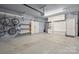 Garage with storage shelves, bike rack, and workbench at 6030 Sharon Hills Rd, Charlotte, NC 28210