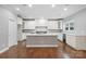 Spacious kitchen with white cabinets, large island, and stainless steel appliances at 6030 Sharon Hills Rd, Charlotte, NC 28210