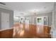 Open living space with hardwood floors, and access to the backyard at 6030 Sharon Hills Rd, Charlotte, NC 28210