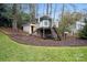 Wooden playset with slide, climbing wall, and stairs at 6030 Sharon Hills Rd, Charlotte, NC 28210