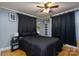 Cozy bedroom with a double bed and dark curtains at 604 Kimball St, Kannapolis, NC 28081