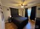 Cozy bedroom with a double bed, hardwood floors, and dark curtains at 604 Kimball St, Kannapolis, NC 28081