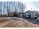 Gray house with small deck and gravel driveway at 604 Kimball St, Kannapolis, NC 28081