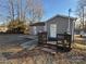 Side view of home with rocking chairs on patio at 604 Kimball St, Kannapolis, NC 28081