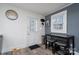 Kitchen with white cabinets, stainless steel appliances, and small breakfast bar at 604 Kimball St, Kannapolis, NC 28081