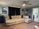 Spacious living room with sectional sofa and ceiling fan at 604 Kimball St, Kannapolis, NC 28081