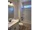 Modern bathroom with a vanity, toilet, and tub/shower combination at 6327 Honor Ave, Midland, NC 28107