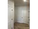 Hallway with wood floors and white doors at 6327 Honor Ave, Midland, NC 28107