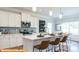 Modern kitchen with white cabinets, center island, and subway tile at 6327 Honor Ave, Midland, NC 28107