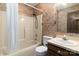 Full bathroom featuring a shower-tub combo and classic floral wallpaper at 7753 Old Post Rd, Denver, NC 28037