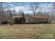 Rear exterior view of the home highlighting the neutral siding and well-maintained roof at 7753 Old Post Rd, Denver, NC 28037