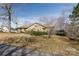 Charming exterior with neutral tones, mature landscaping, and a cozy front porch at 7753 Old Post Rd, Denver, NC 28037