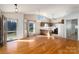 Sunlit kitchen with wood cabinets and hardwood floors at 7753 Old Post Rd, Denver, NC 28037