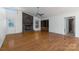 Spacious living room featuring a brick fireplace and hardwood floors at 7753 Old Post Rd, Denver, NC 28037