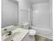 Clean bathroom with a bathtub, toilet, and single sink vanity at 811 Reigate Rd, Charlotte, NC 28262