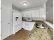 Kitchen with white cabinets, granite countertops, and stainless steel appliances at 811 Reigate Rd, Charlotte, NC 28262