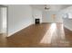 Bright living room with fireplace and tile floors at 811 Reigate Rd, Charlotte, NC 28262