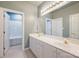 Double vanity bathroom with a shower and tub at 8355 Olde Troon Dr, Charlotte, NC 28277