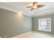 Spacious bedroom with ceiling fan and neutral wall paint at 8355 Olde Troon Dr, Charlotte, NC 28277