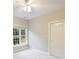 Well-lit bedroom featuring a large window and door at 8355 Olde Troon Dr, Charlotte, NC 28277