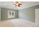 Light and airy bedroom with ceiling fan and neutral decor at 8355 Olde Troon Dr, Charlotte, NC 28277