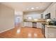 Eat-in kitchen featuring granite countertops and ample cabinet space at 8355 Olde Troon Dr, Charlotte, NC 28277