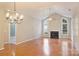 Open concept living room, dining area and kitchen with hardwood floors at 8355 Olde Troon Dr, Charlotte, NC 28277