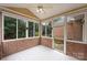 Sunroom with brick walls and access to backyard at 8355 Olde Troon Dr, Charlotte, NC 28277