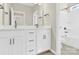 Bathroom with double vanity, white cabinets, and shower/tub combo at 9131 Nw Harwen Ne Ln # 32, Charlotte, NC 28215