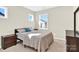 Light and airy bedroom with neutral tones and ample natural light at 9131 Nw Harwen Ne Ln # 32, Charlotte, NC 28215