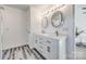 Modern bathroom with double vanity, large mirrors and white cabinets at 100 Sea Island Blvd, Fort Mill, SC 29708