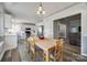 Bright dining area with kitchen and living room views, wood table and chairs at 100 Sea Island Blvd, Fort Mill, SC 29708