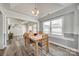 Dining area with a wooden table and chairs, open to the living room and kitchen at 100 Sea Island Blvd, Fort Mill, SC 29708