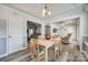 Charming dining area with wood table and chairs, open to kitchen and living room at 100 Sea Island Blvd, Fort Mill, SC 29708