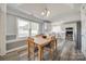 Dining area with a wooden table, chairs, and views of the kitchen at 100 Sea Island Blvd, Fort Mill, SC 29708